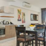 Canal Quays 306 - Dining table and stove